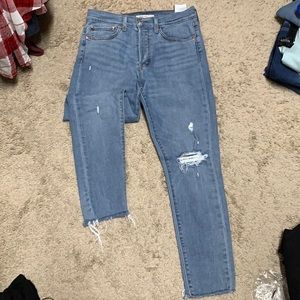 Levis Wedgie distressed skinny jeans.